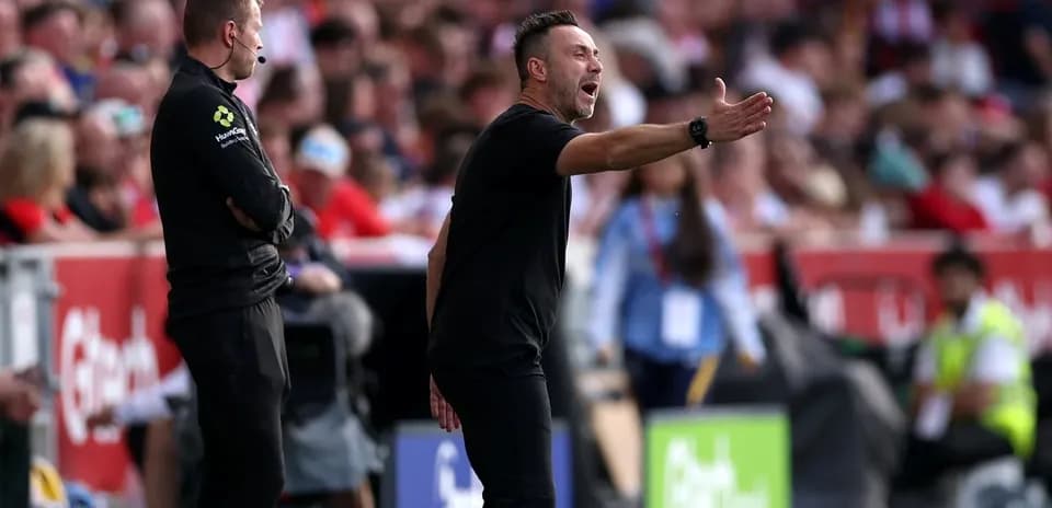 Coach gesturing during match on the sidelines