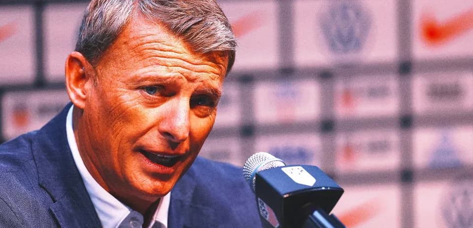 Manager speaking at press conference with microphone