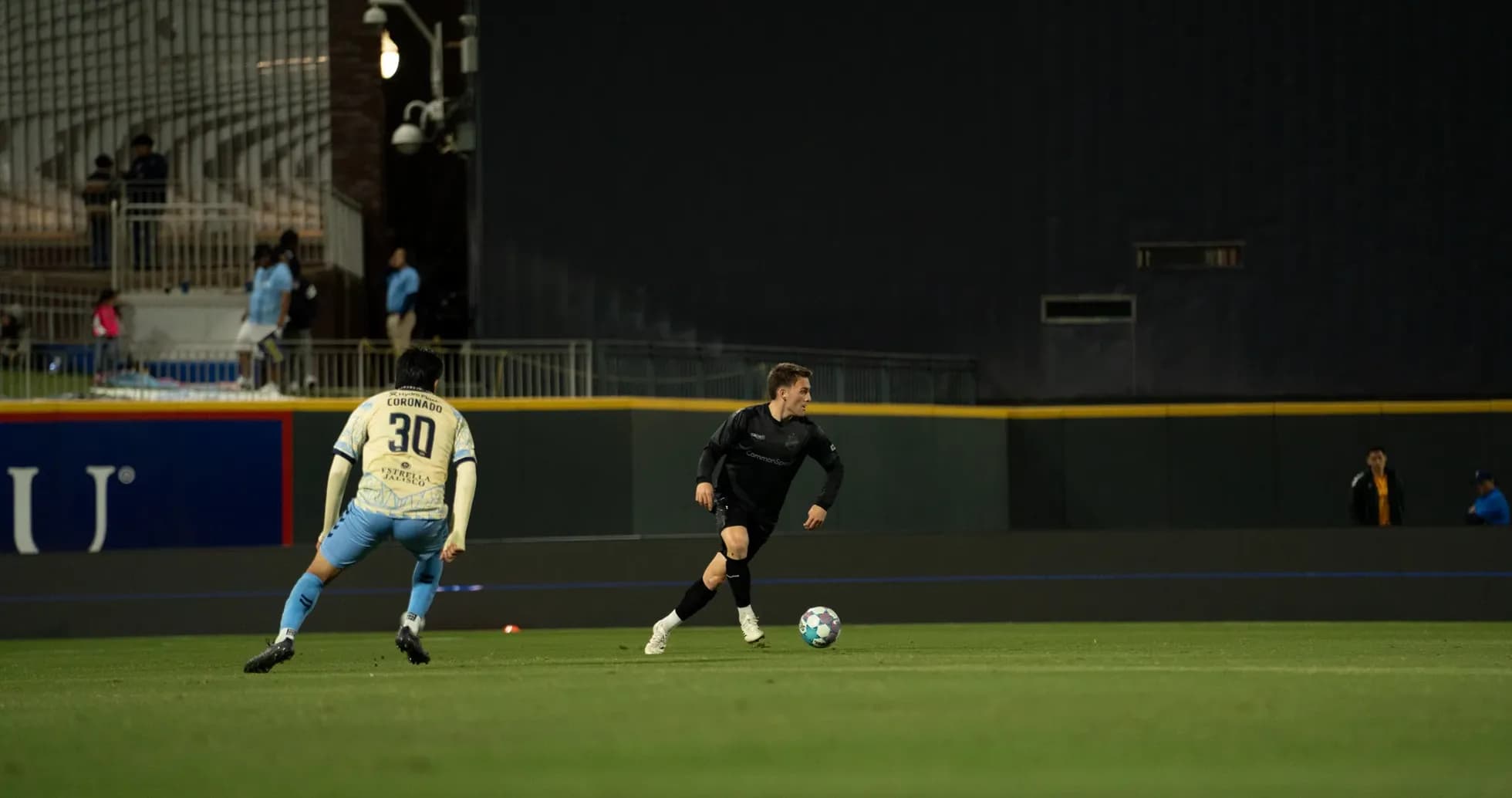 Player dribbling the ball during USL match