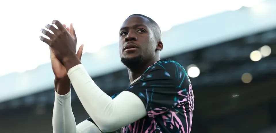 Player applauding fans in colorful training kit