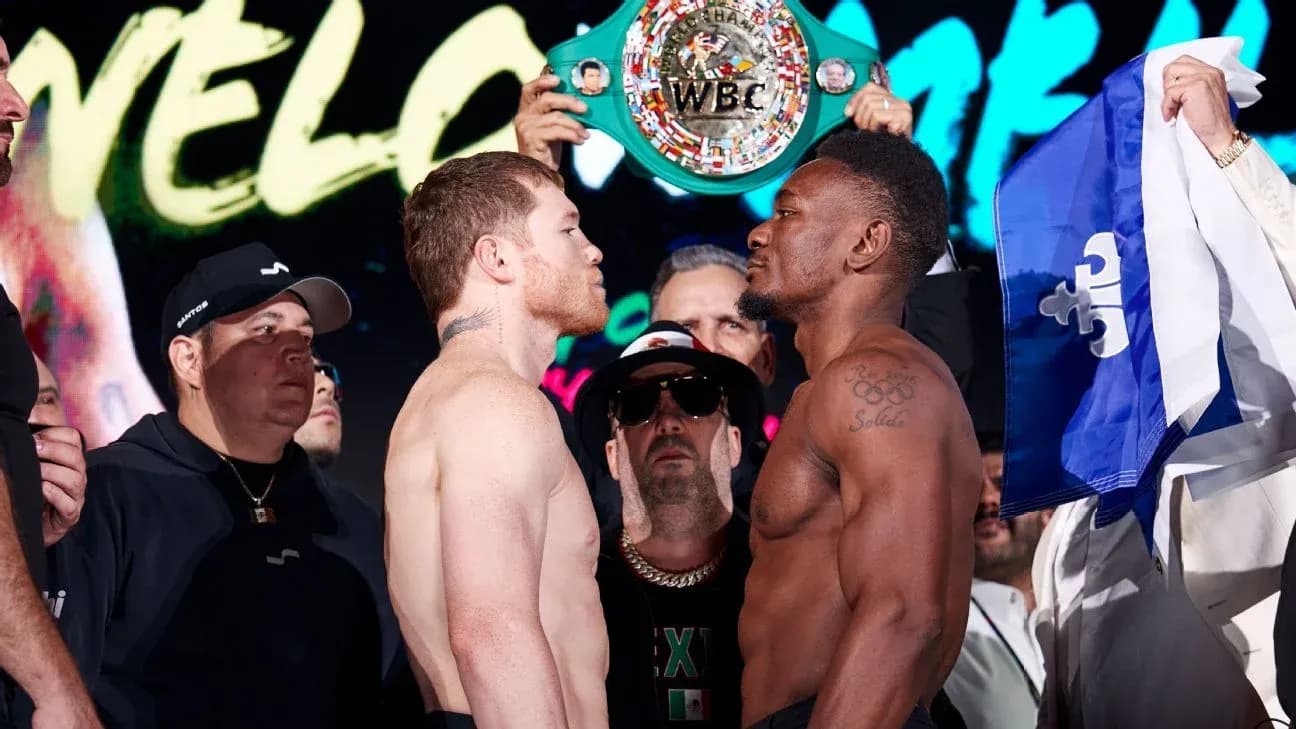 Boxers facing off at weigh-in with championship belt