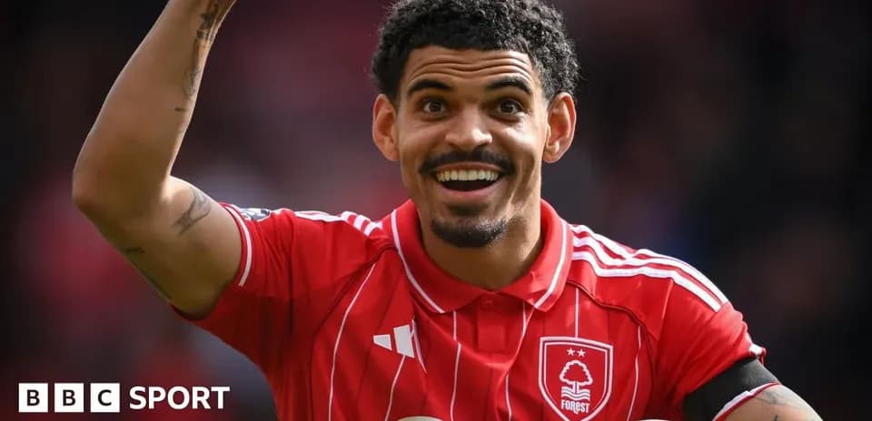 Player celebrating enthusiastically in red jersey