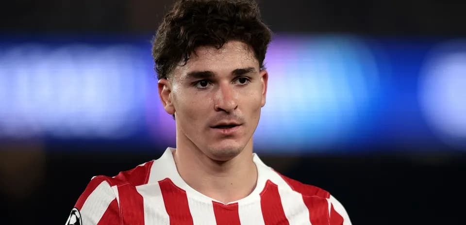 Atletico Madrid player in red and white jersey