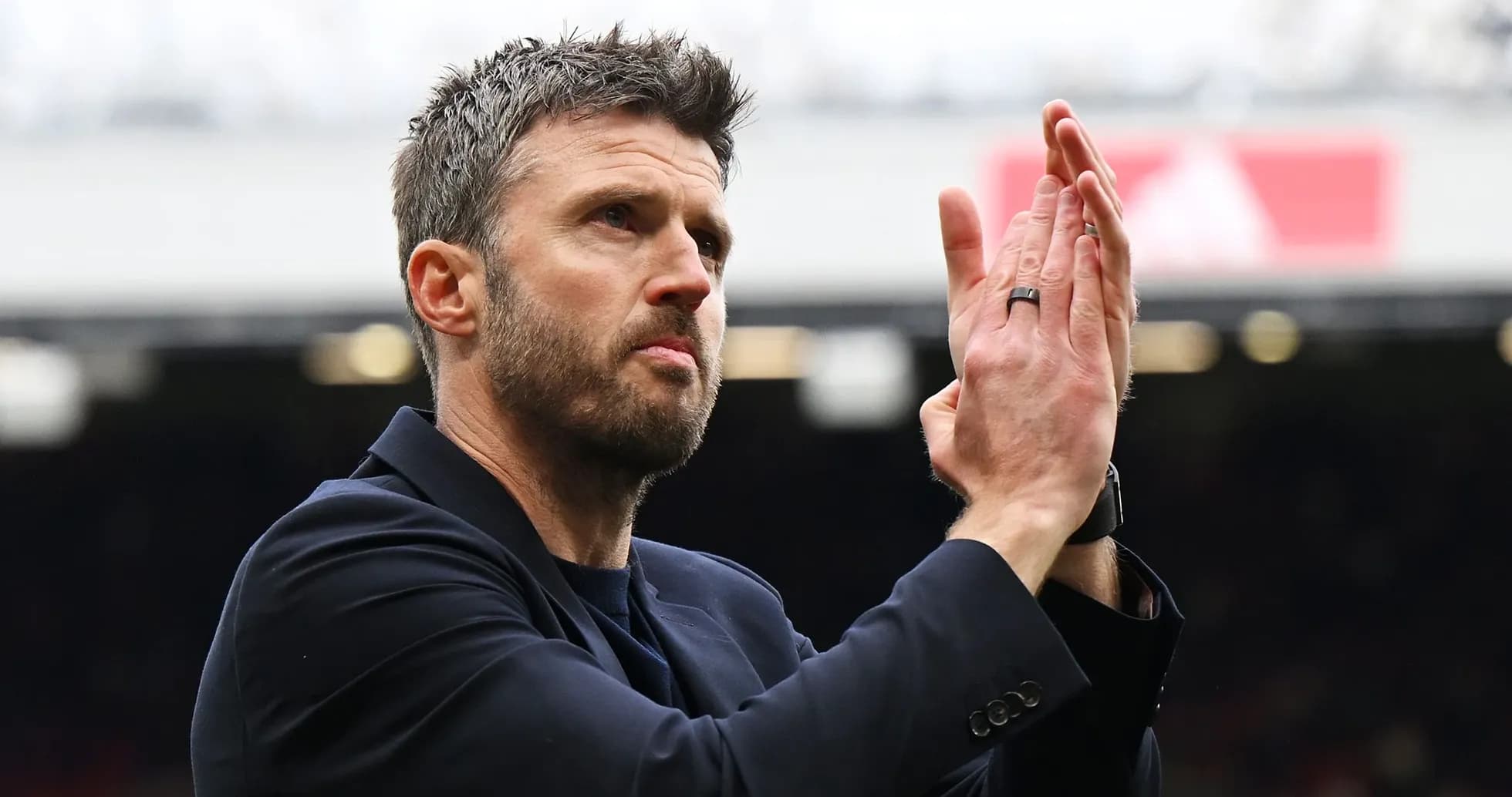 Man clapping during a football match at stadium