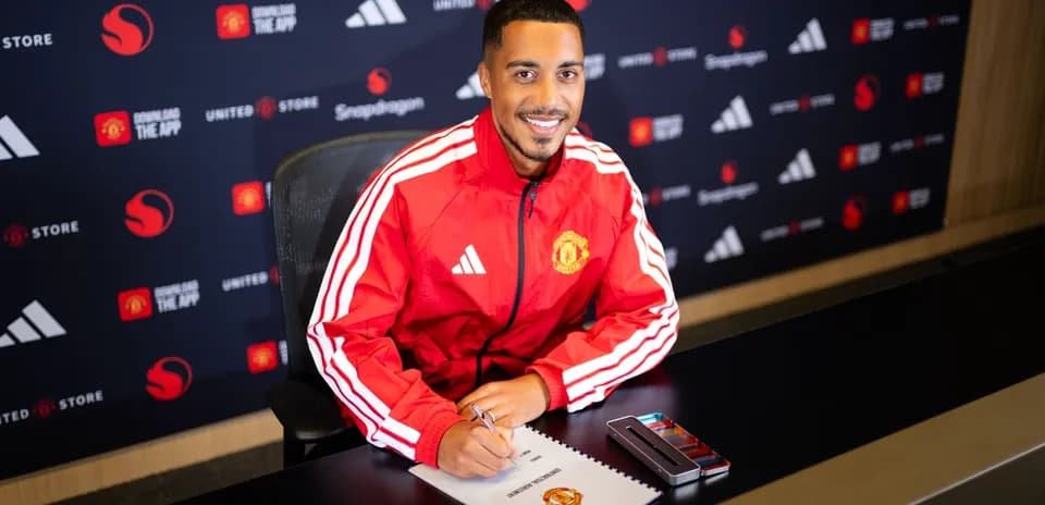 Player signing contract at Manchester United press event
