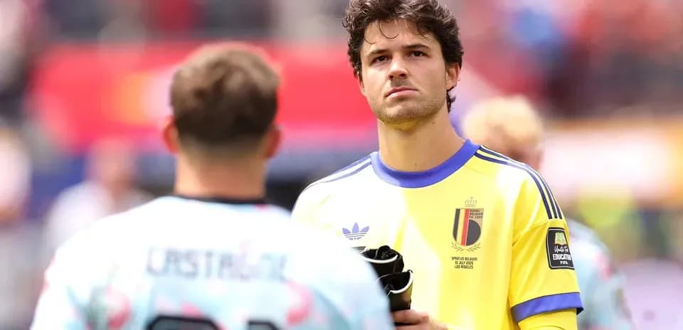 Goalkeeper in yellow jersey during pre-match warm-up