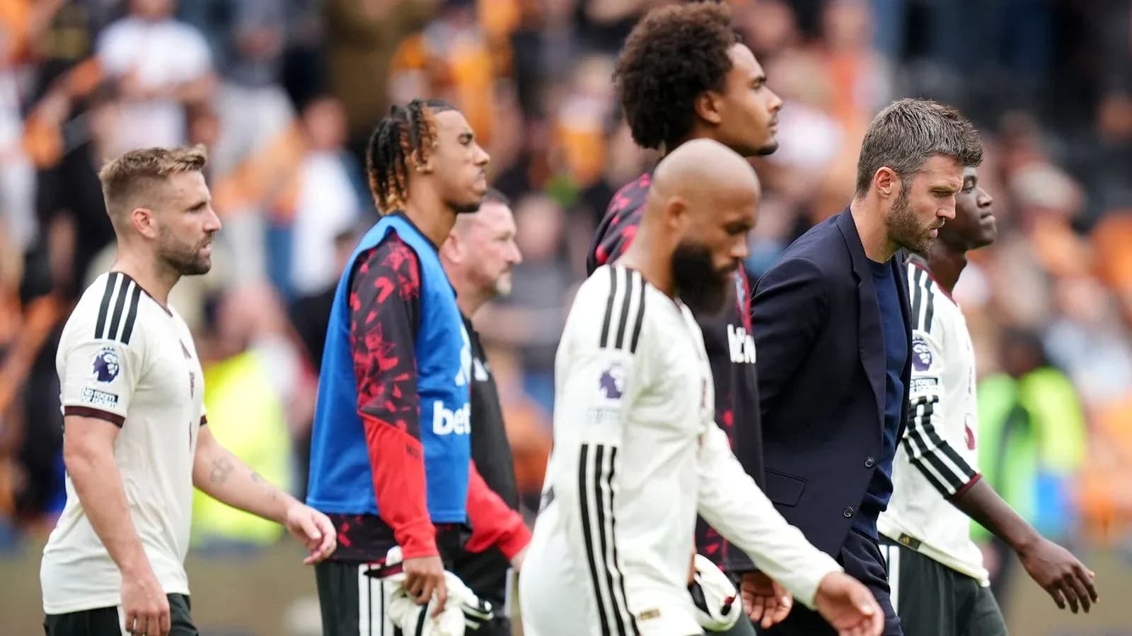 Players walking off the pitch after match