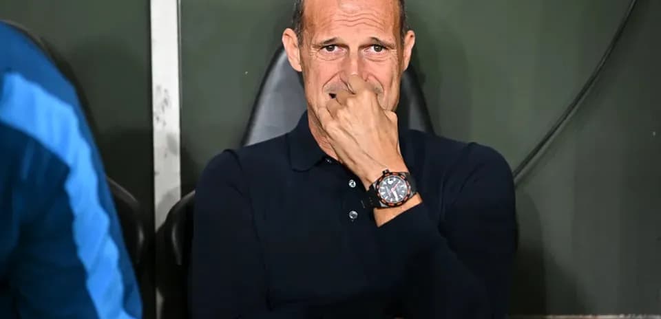Coach sitting on bench during a match