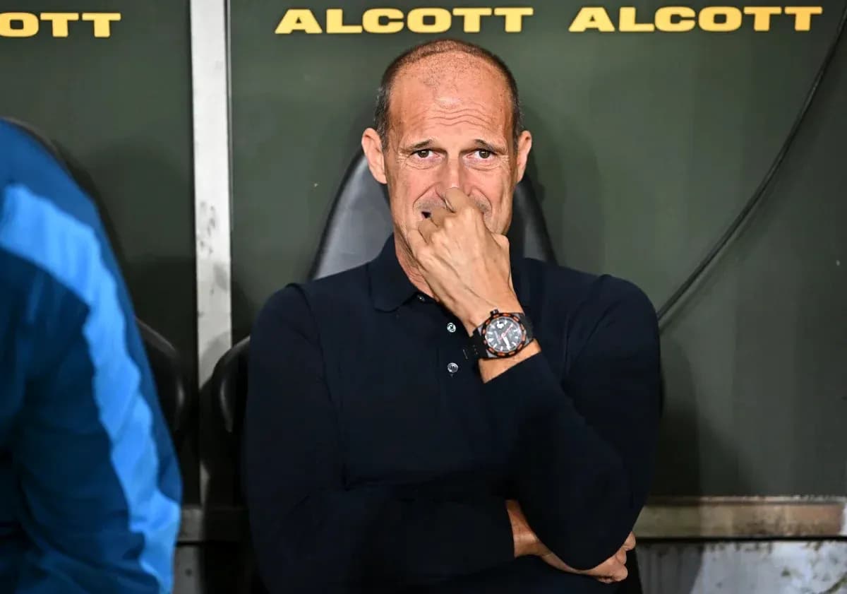 Coach sitting on bench during a match