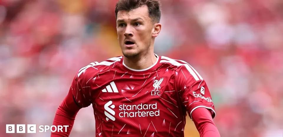 Player in red Liverpool kit on the pitch