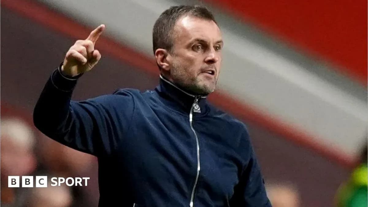 Coach gesturing during a match on the sideline