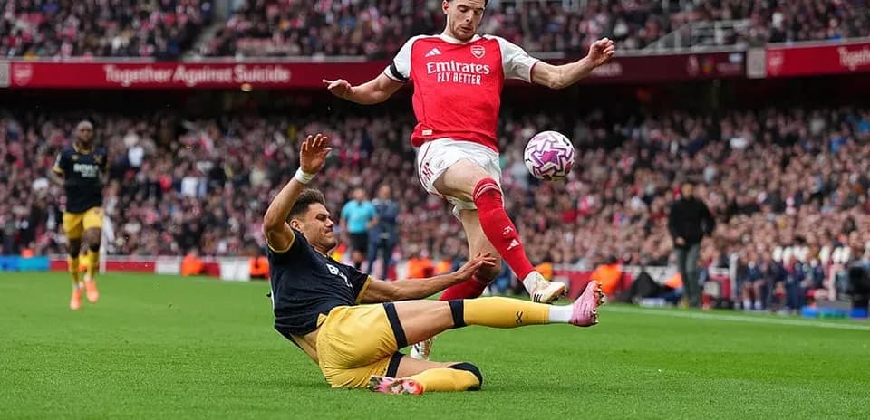 Player tackling during West Ham vs Arsenal match