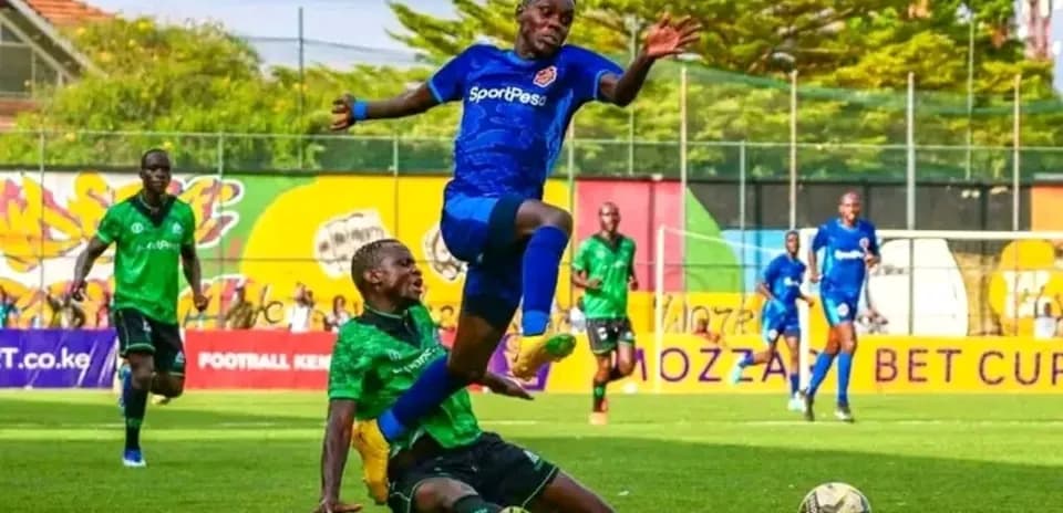 Player jumping over opponent during football match