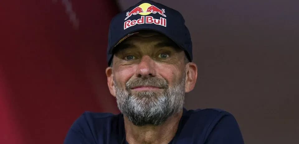 Man wearing a Red Bull cap smiling