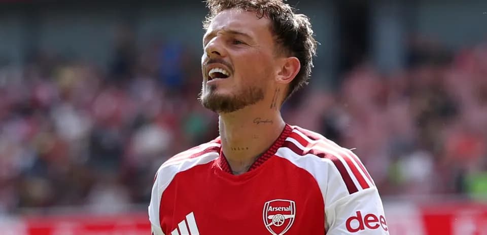 Player wearing Arsenal kit during match action