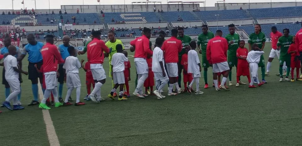 Teams shaking hands before Barau FC vs Enugu Rangers
