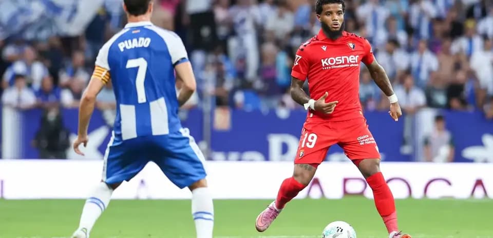 Osasuna player dribbling during La Liga match