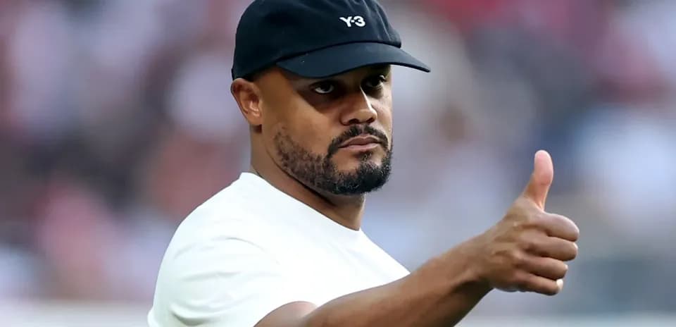 Man giving a thumbs up on the field