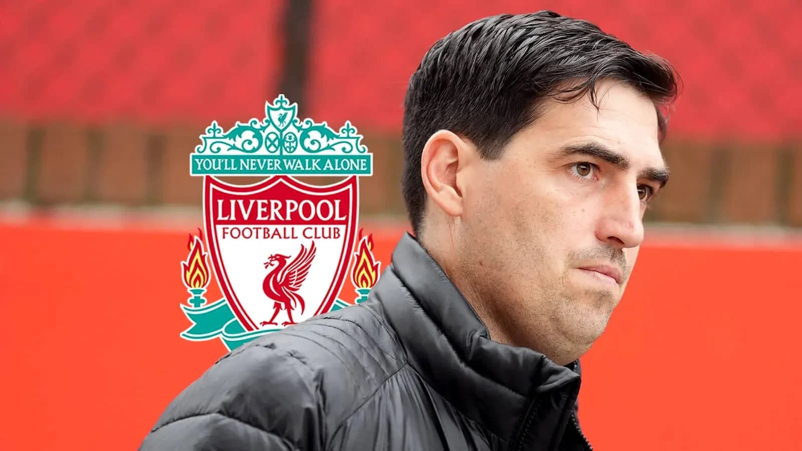 Coach standing near Liverpool FC logo backdrop