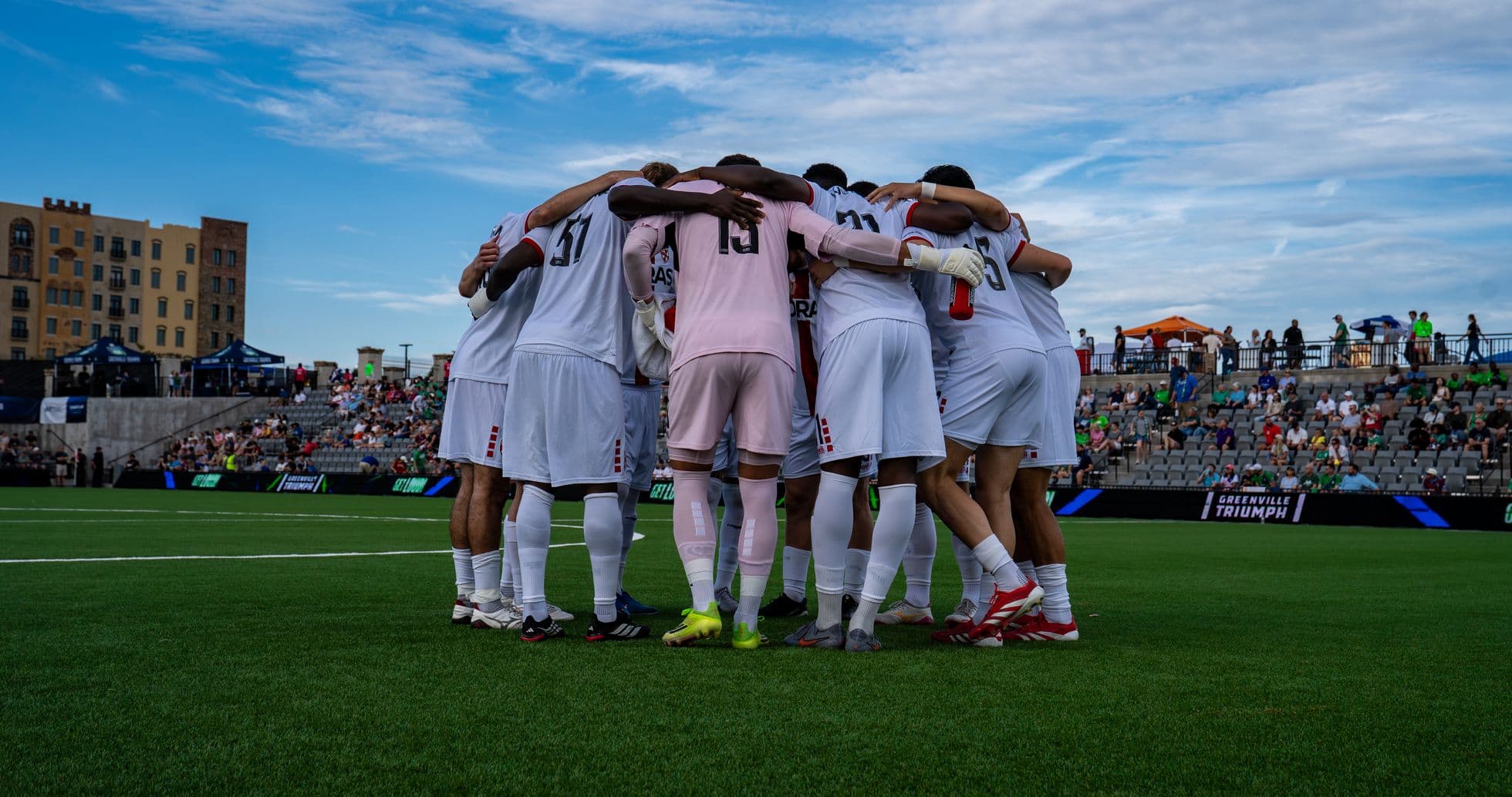 Greenville Triumph players in huddle before match