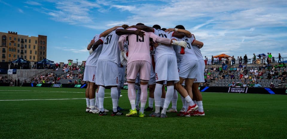 Greenville Triumph players in huddle before match