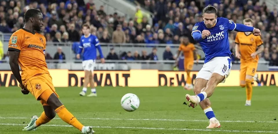 Player shooting the ball during a football match