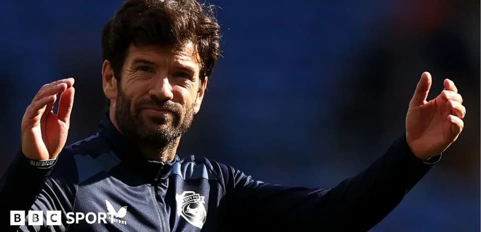Manager gesturing during training session at stadium