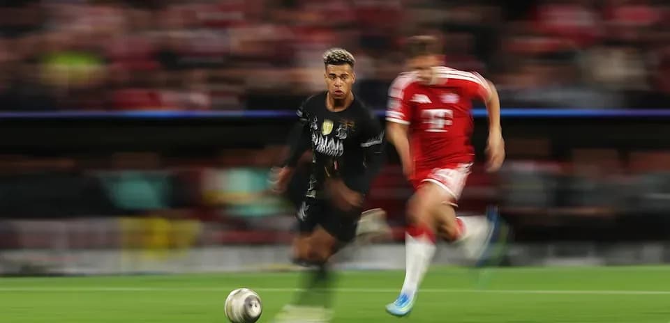 Player running with ball during intense match action