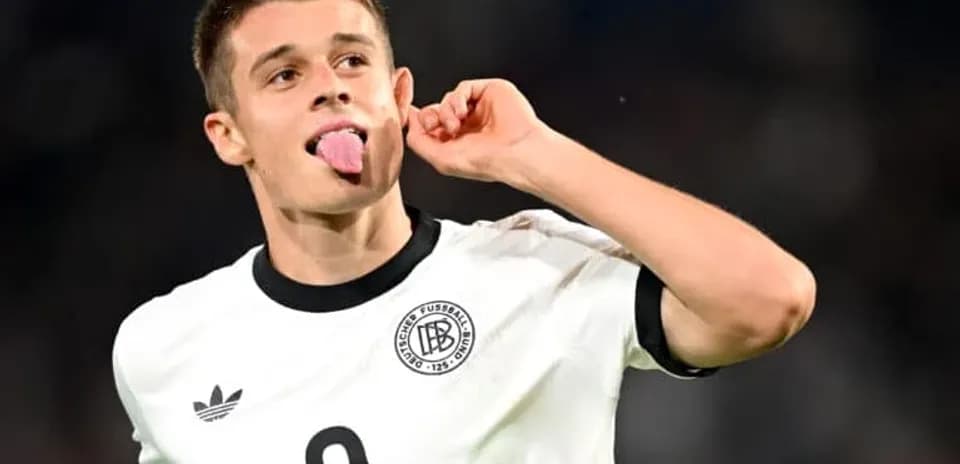 Player celebrating with tongue out in Germany kit