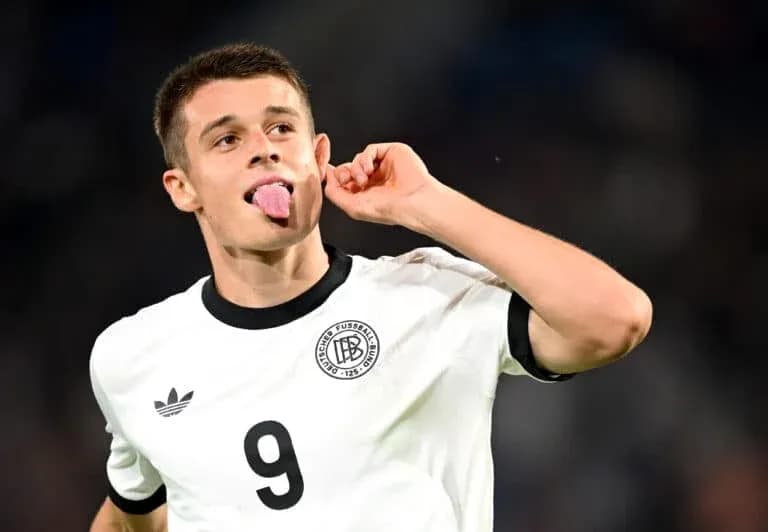 Player celebrating with tongue out in Germany kit