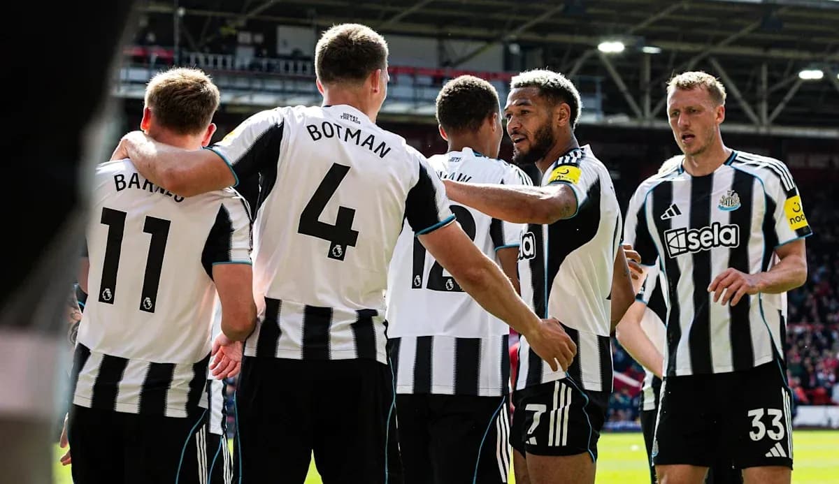 Newcastle players celebrating a goal together