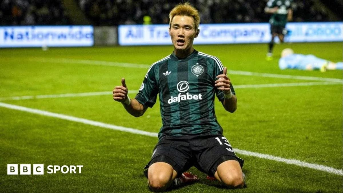 Player celebrating on pitch after scoring a goal