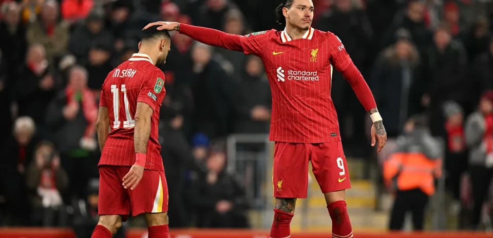 Liverpool players discussing during a match