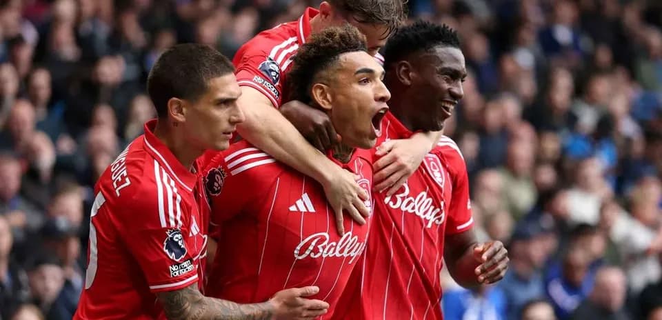 Players celebrating a goal on the pitch