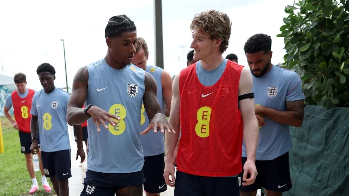 Players discussing during England training session