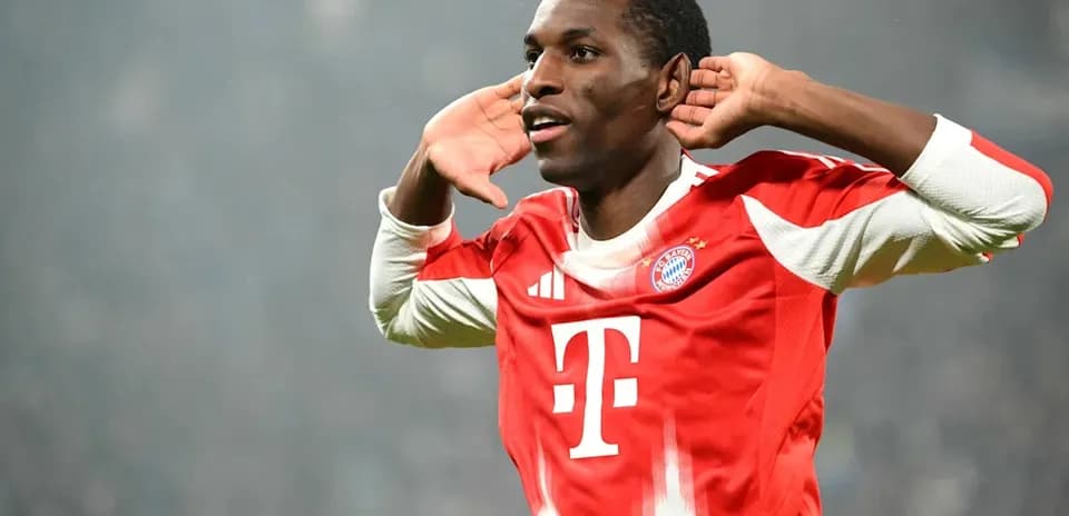 Player celebrating a goal with hands to ears