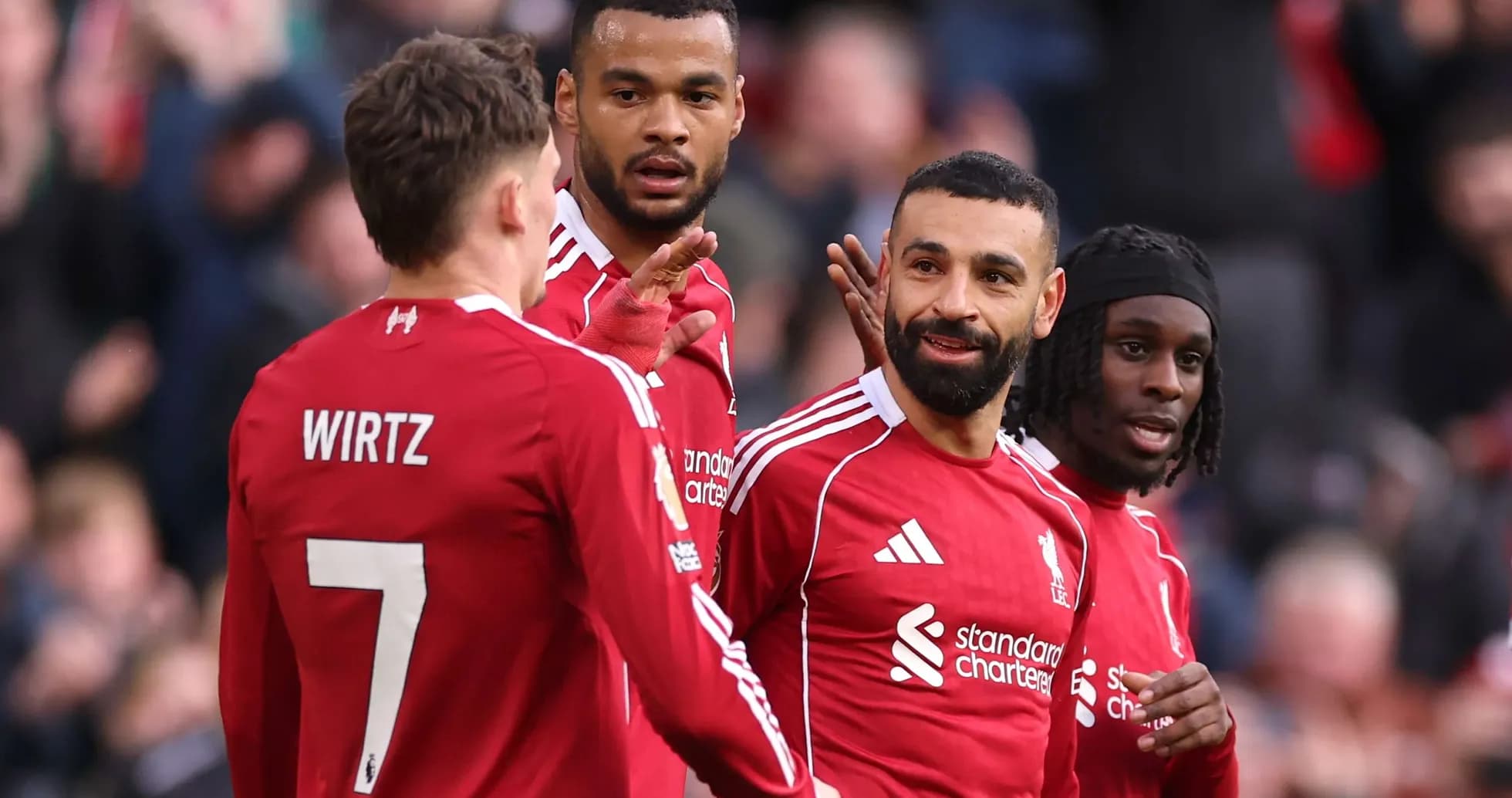 Liverpool players celebrating a goal during match