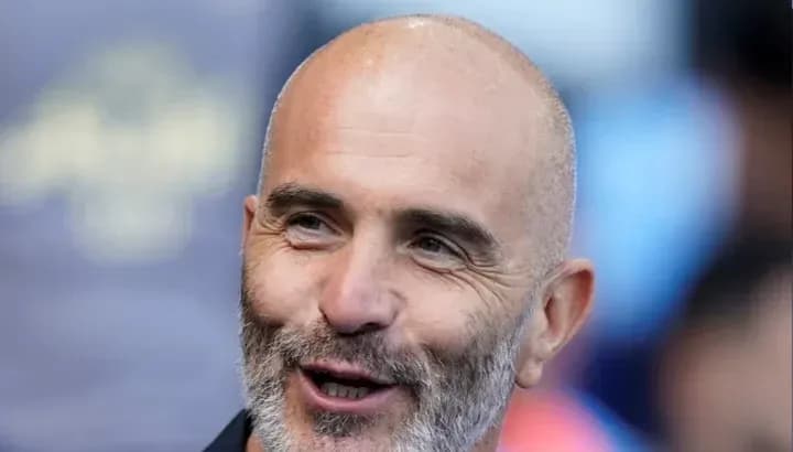 Coach smiling during a match event