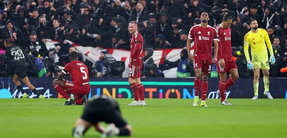 Liverpool players showing disappointment after match loss
