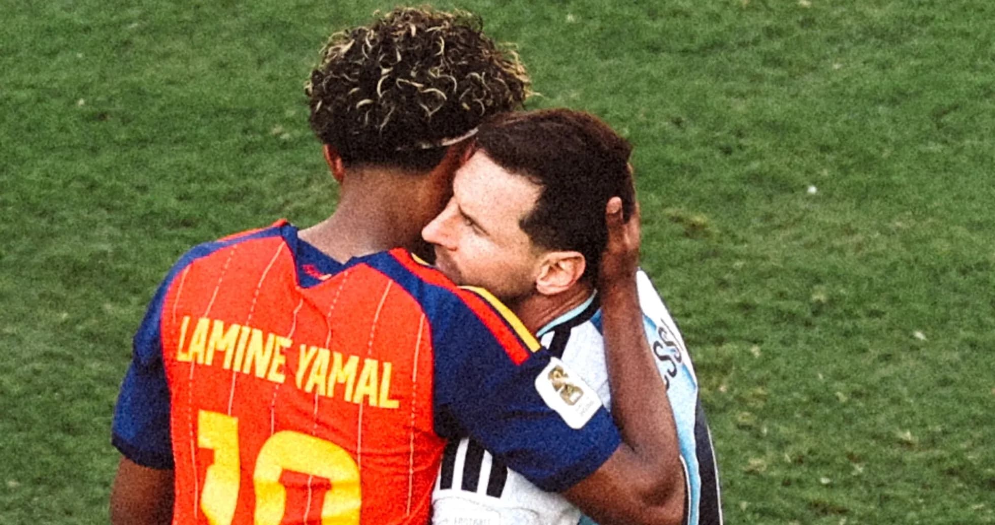 Players embracing on the field after match