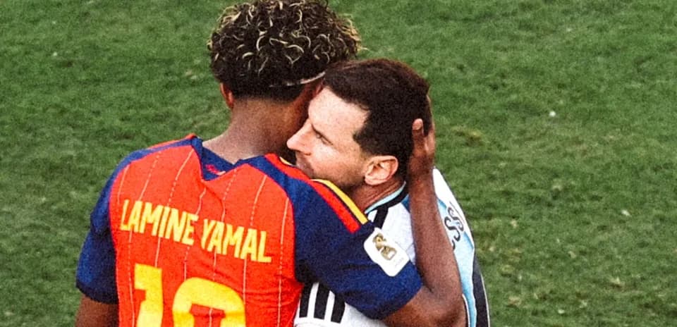 Players embracing on the field after match