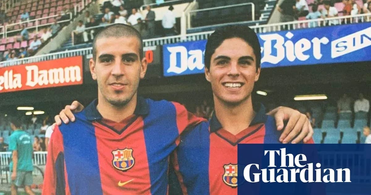 Two young players posing in Barcelona jerseys