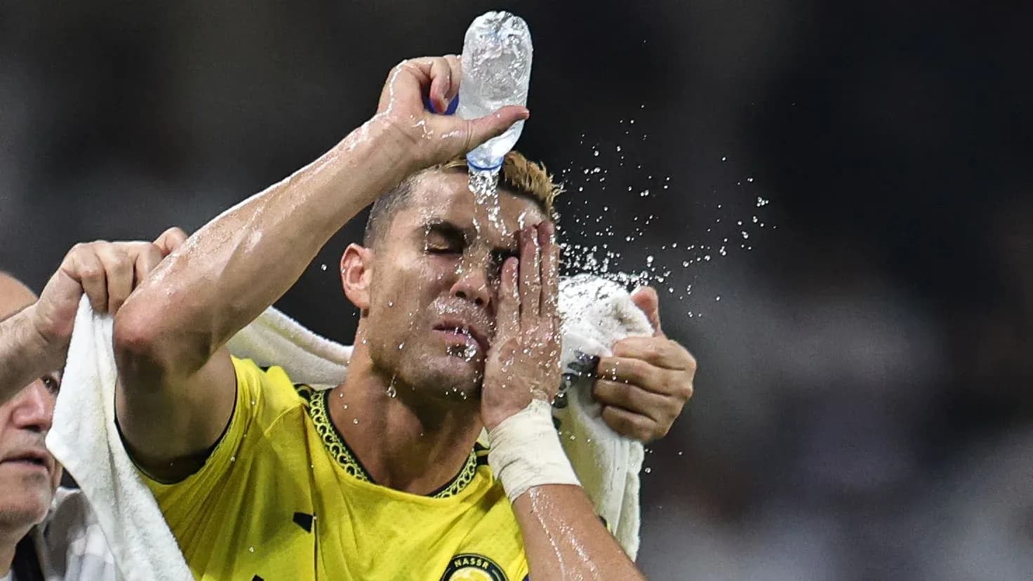 Player cooling off with water during match