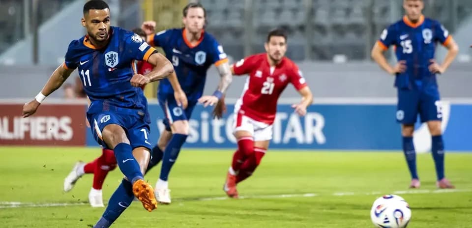 Player taking a penalty kick during a match