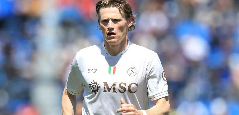 Player in Napoli jersey running on the field