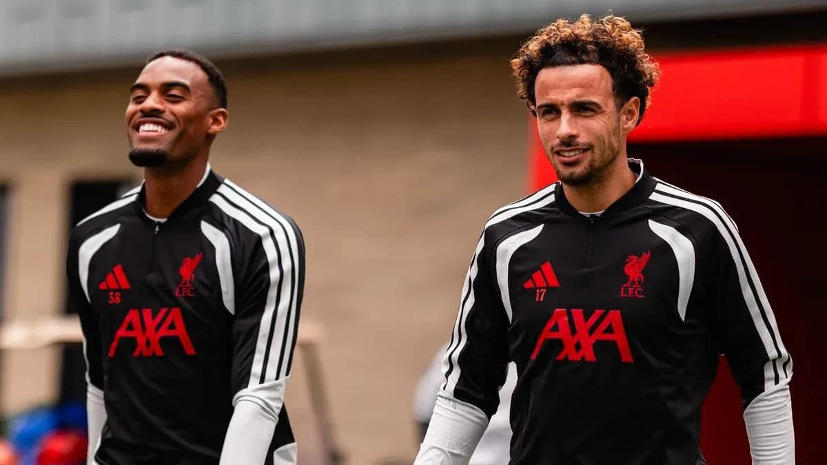 Two Liverpool players arriving for training session