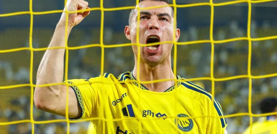 Player celebrating a goal behind the net