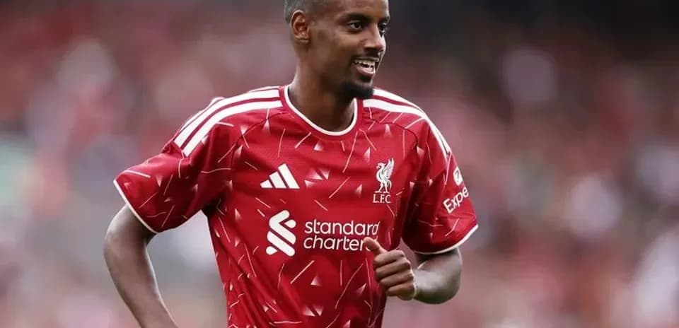 Player in Liverpool kit celebrating on the field