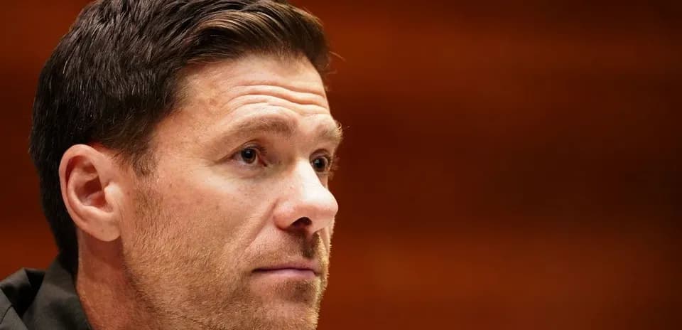 Man with short hair and stubble in profile