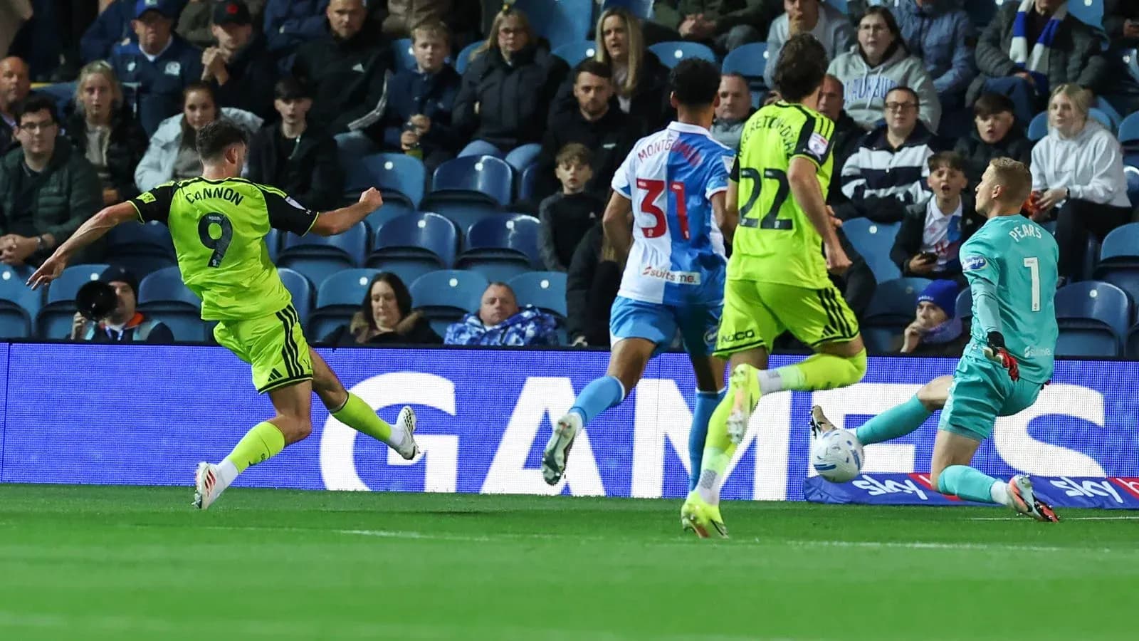 Player shooting at goal during a football match